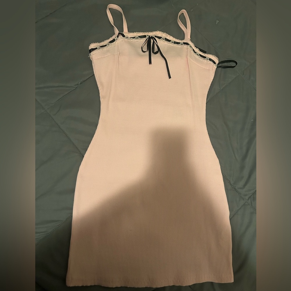Elegant Pink Sleeveless Dress with Black Trim